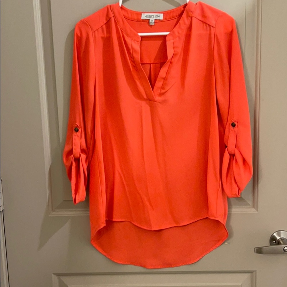 Neon coral top, perfect for the office.